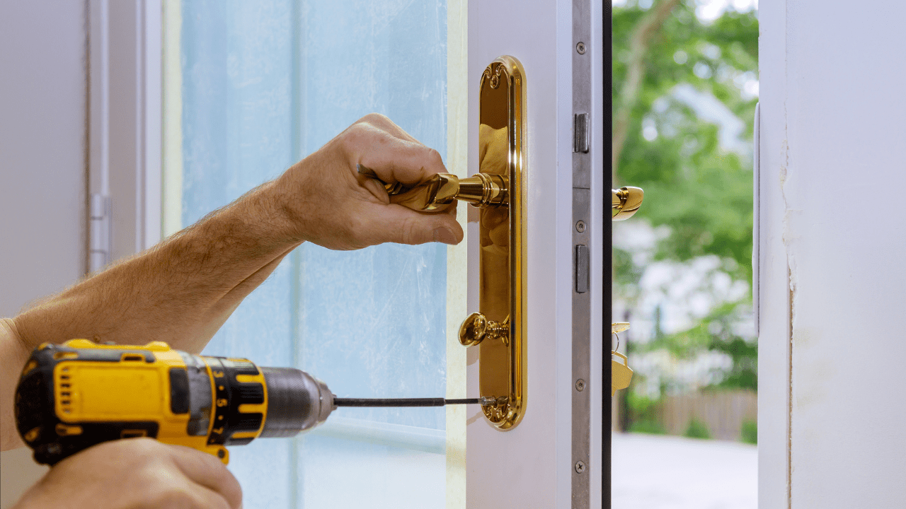 Residential locksmith in Ottawa changing a front door lock