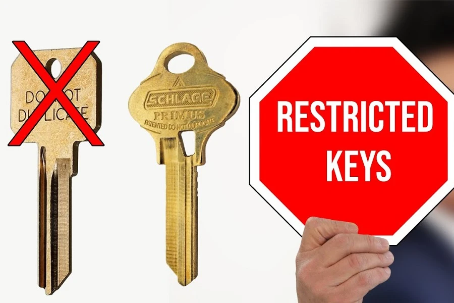 A professional locksmith in uniform handing a restricted key to a customer in a clean, modern workshop in Ottawa. Branded signage in the background, well-lit, secure environment.